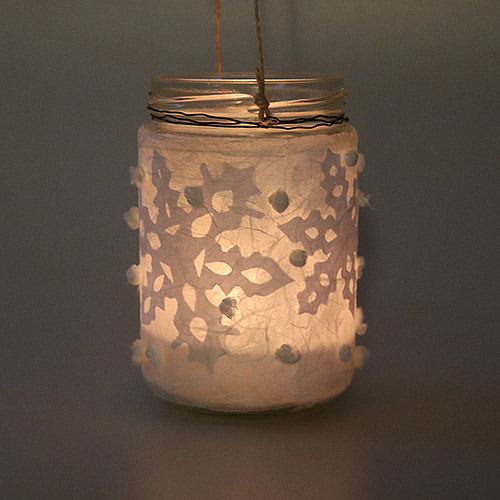 Schneegestöber Windlicht mit Scherenschnitt Schneeflocken